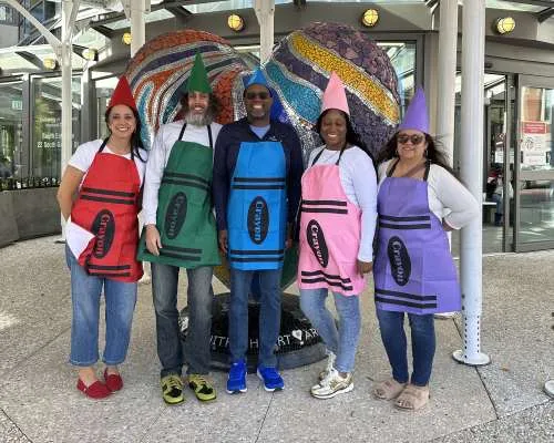 5 people in different color crayon costumes for Halloween