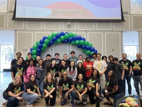 SECU employees and student from UMD pose as a group after completing the Money Masters Challenge