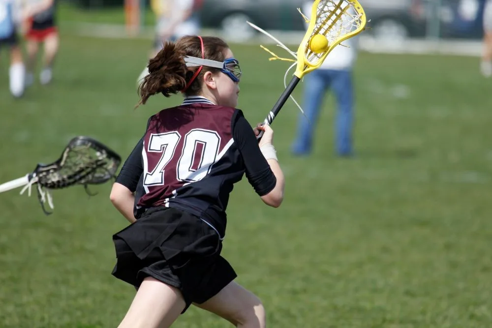 Girl playing lacrosse