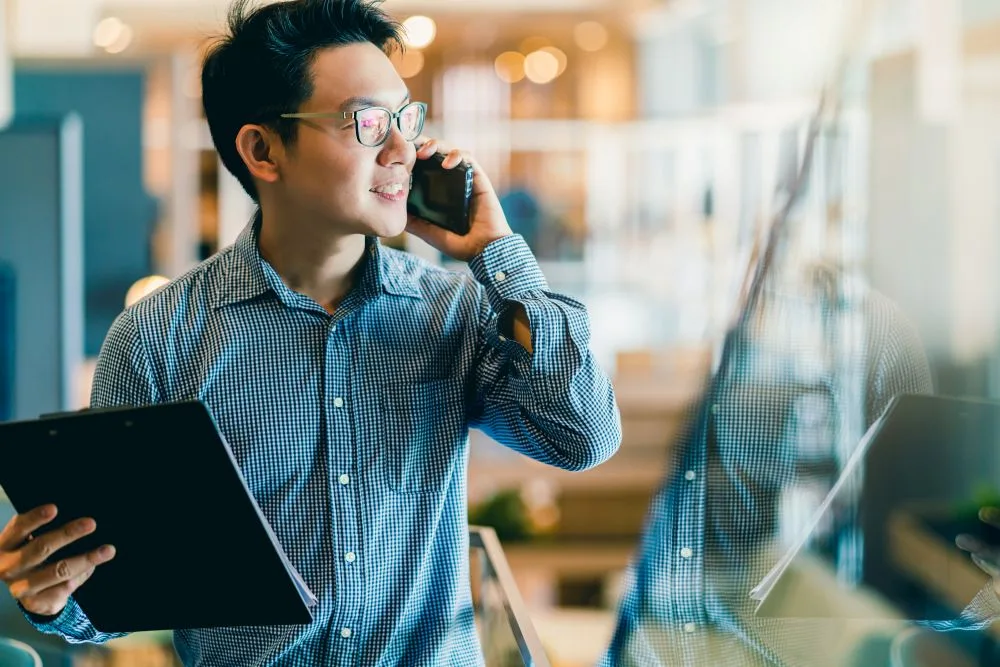 Male business owner talks on phone